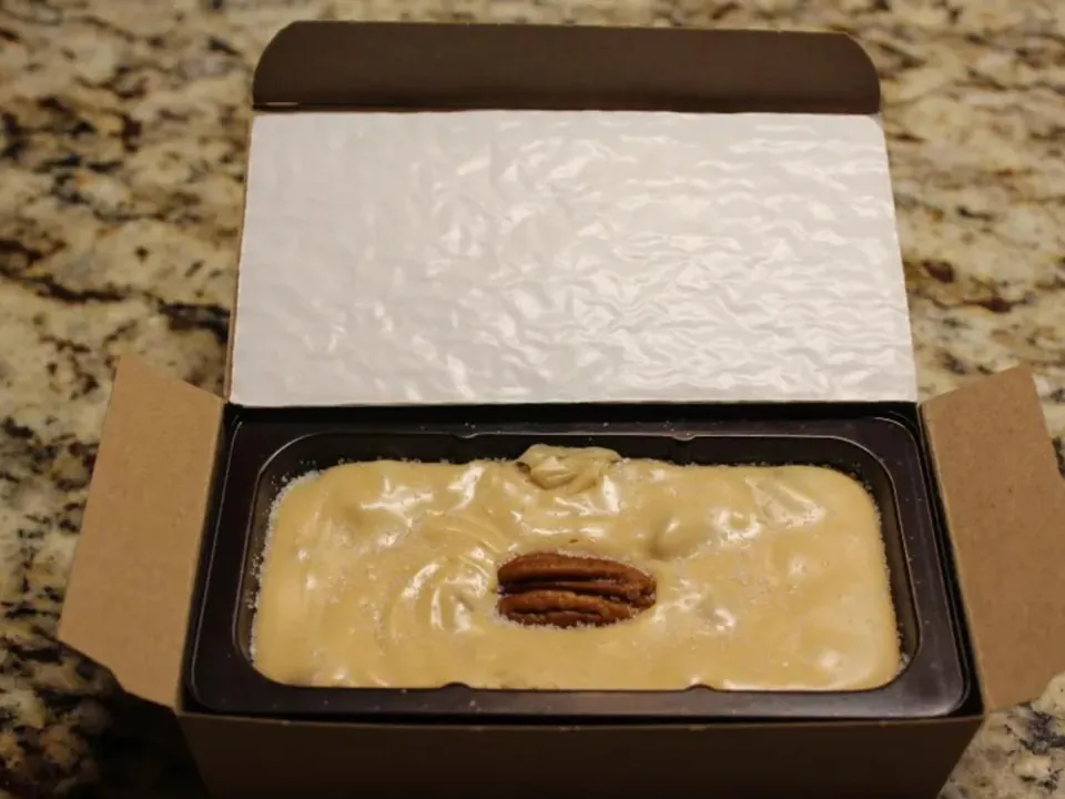 An open Fudge For All box of sea salt caramel pecan fudge